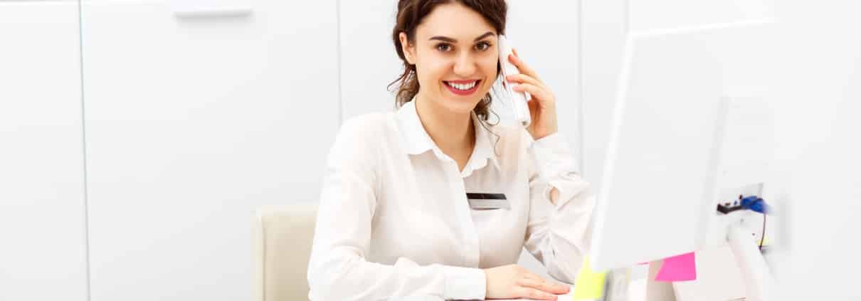 A Billing and Coding Specialist at her desk