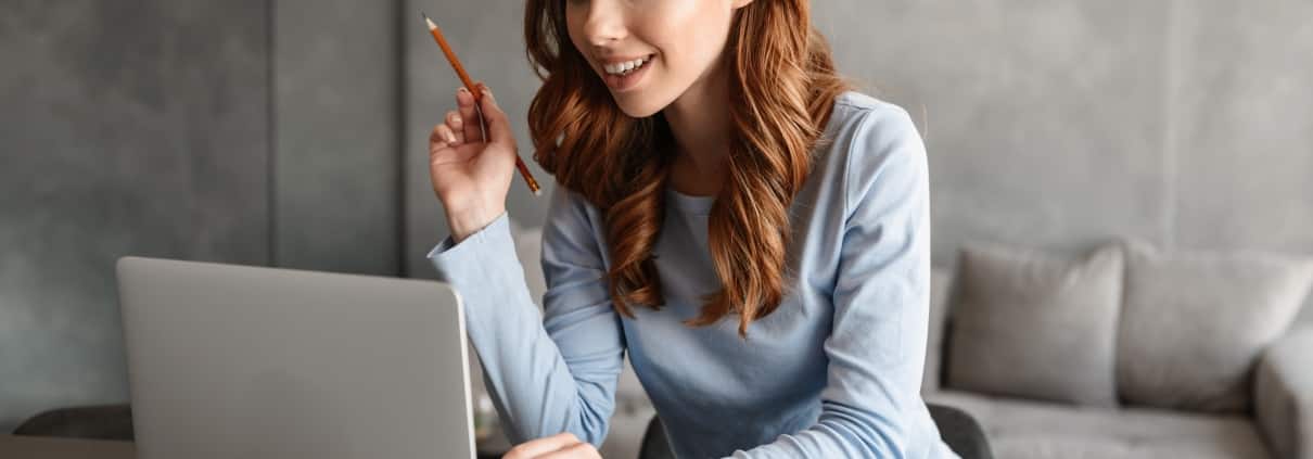 Woman on a laptop taking notes