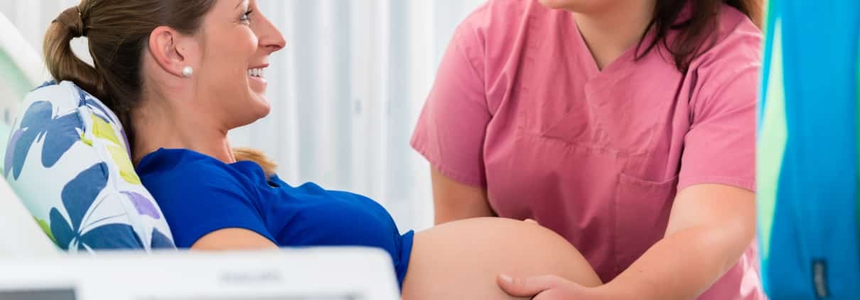 Midwife assisting a pregnant woman