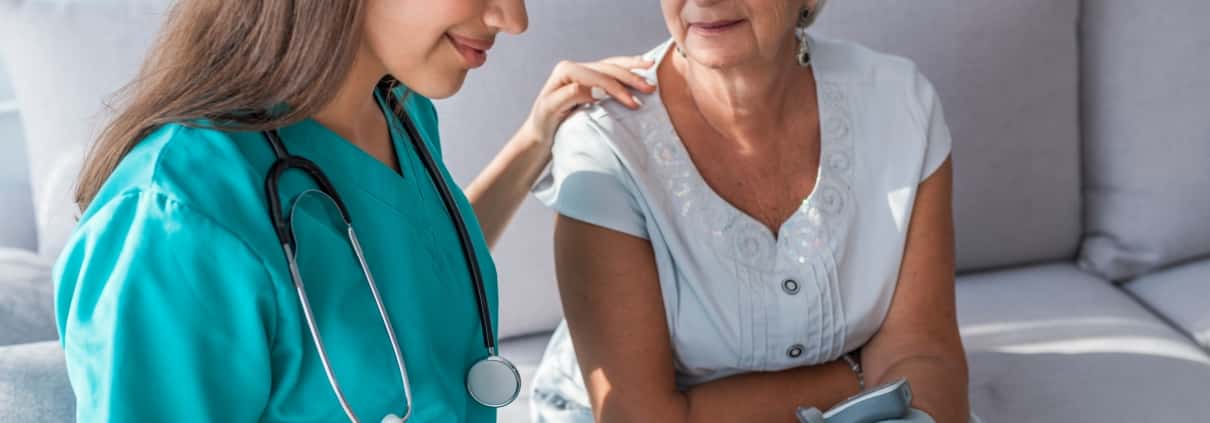 Female nurse with an elderly woman