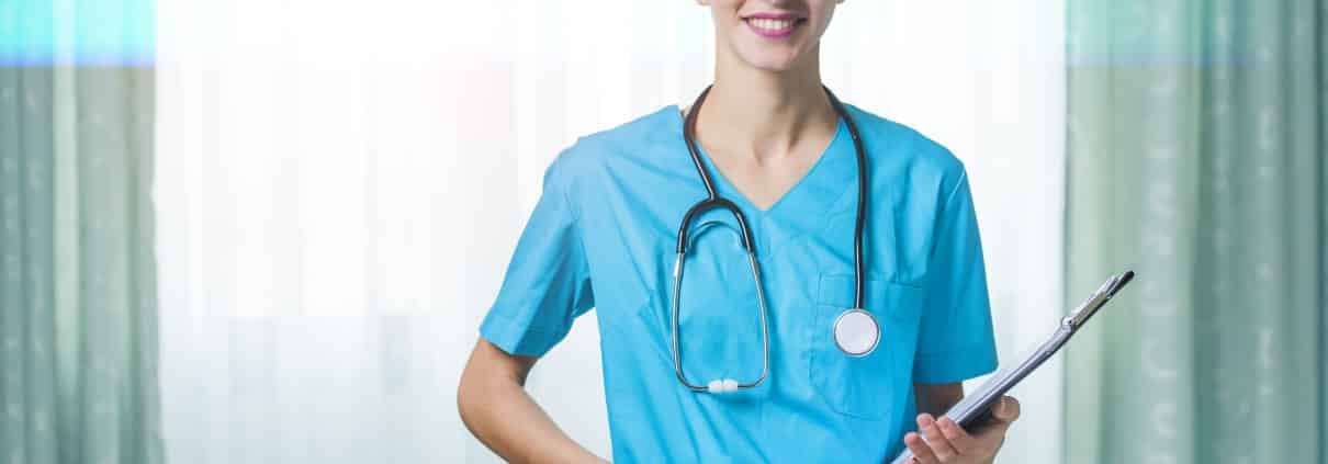 Smiling nurse with a stethoscope and clipboard