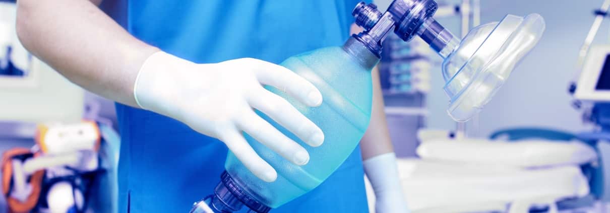 Healthcare professional preparing to intubate