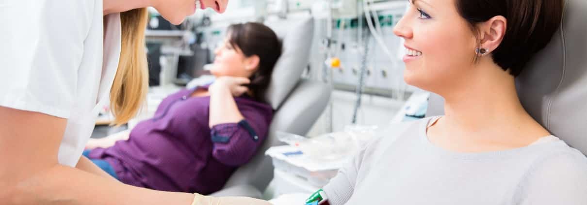 Healthcare professional performing a blood transfusion