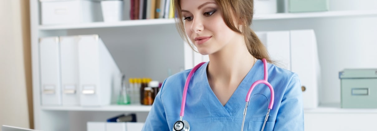 Female healthcare professional on a laptop