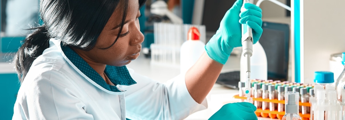 African scientist performs tests in a lab