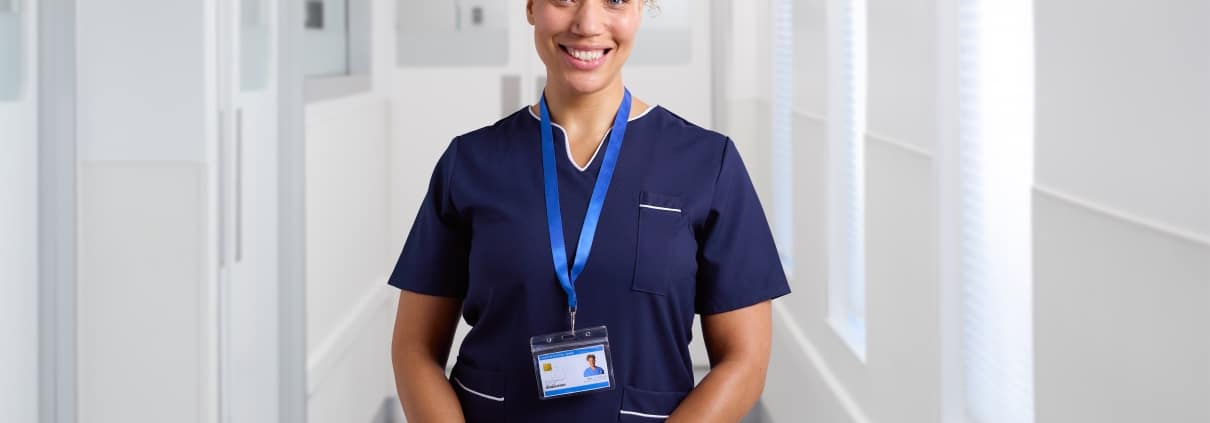 Portrait of a smiling female nurse wearing a uniform