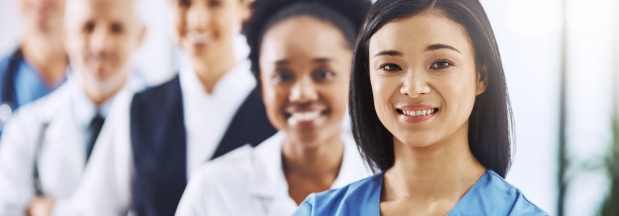 Diverse team of medical professionals standing in a line